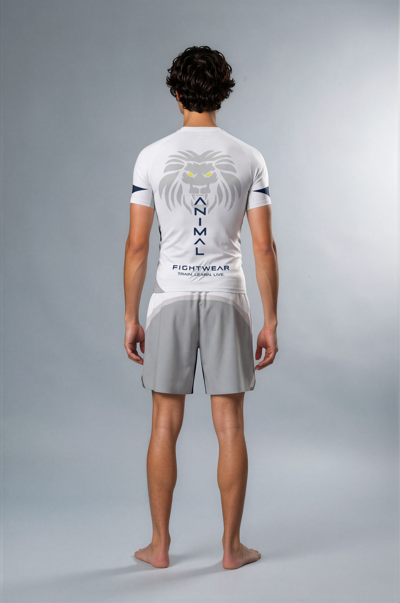 Person wearing a white and gray athletic outfit with a brand logo on a gray background