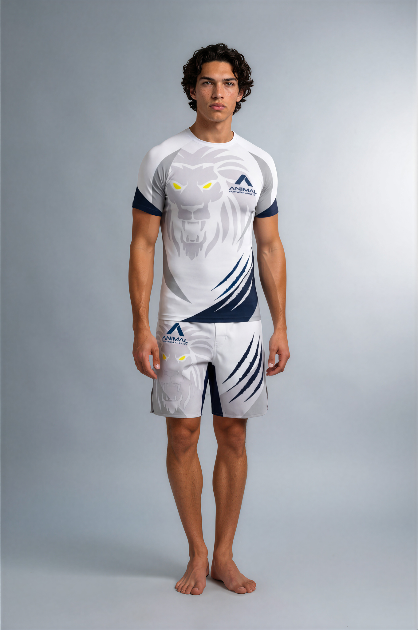 Person wearing a white and navy athletic outfit with logos on a gray background